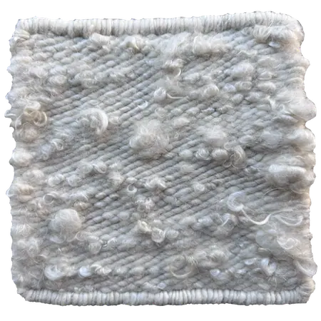 70% merino wool 30% curly mohair in natural white